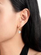 Clarity Drop Hoop Earrings worn on model's ear