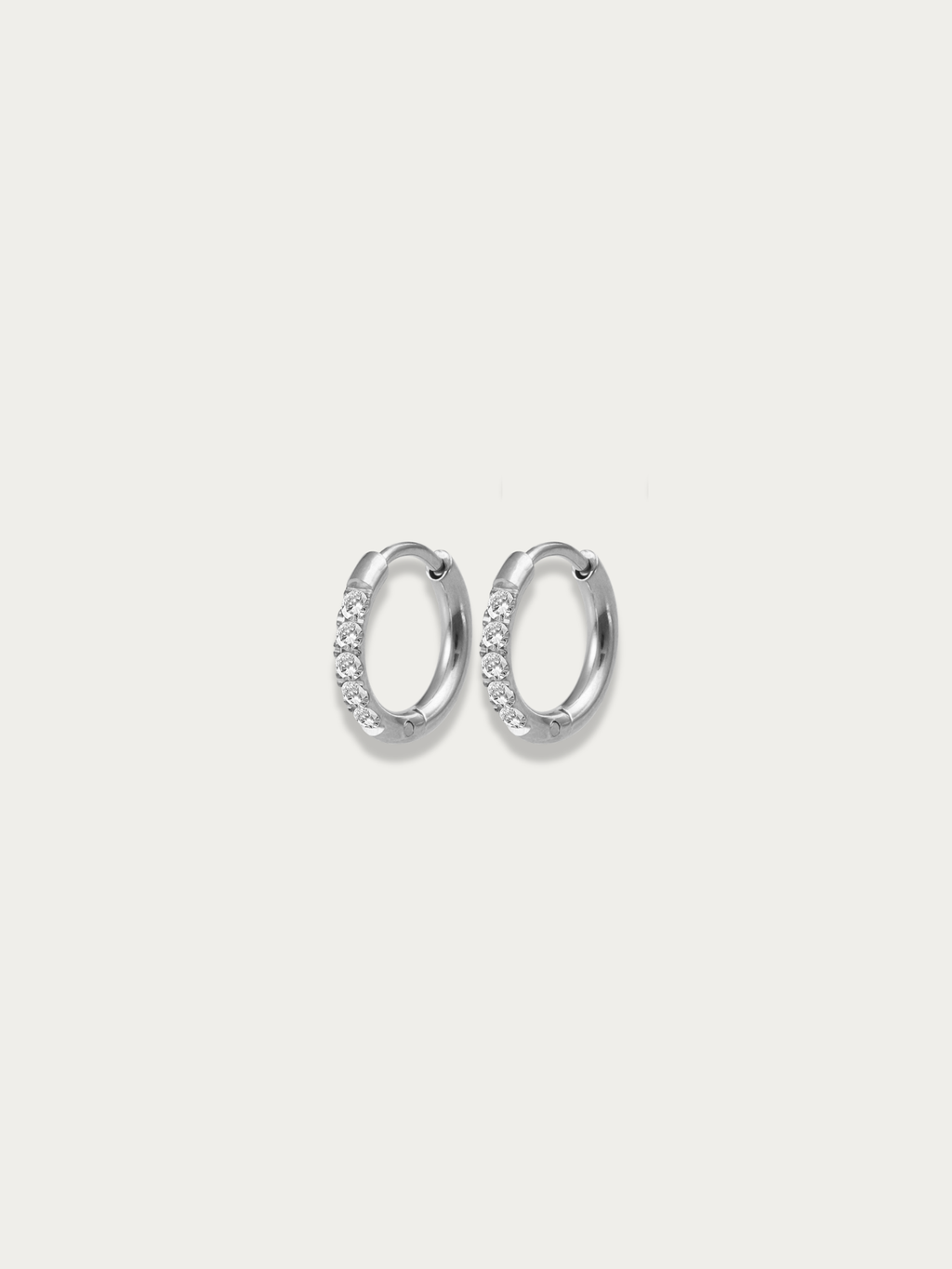 close up pavé stones sparkle huggie earrings in silver color