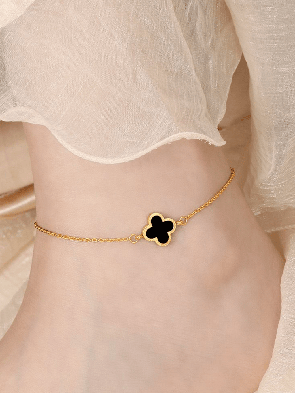 Clover Duo Anklet black enamel variant worn on ankle, gold titanium clover anklet Malaysia lifestyle