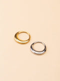 Crescent Nose Ring gold and silver tone titanium, seamless segment ring product flatlay