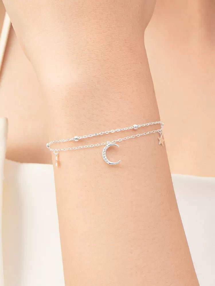 Model wearing CRESSIDA Moon and Stars Bracelet on wrist