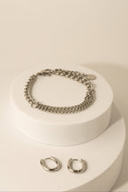 Curb Mixed Layer Chain Bracelet silver tone stainless steel, dual curb chain on white pedestal flatlay