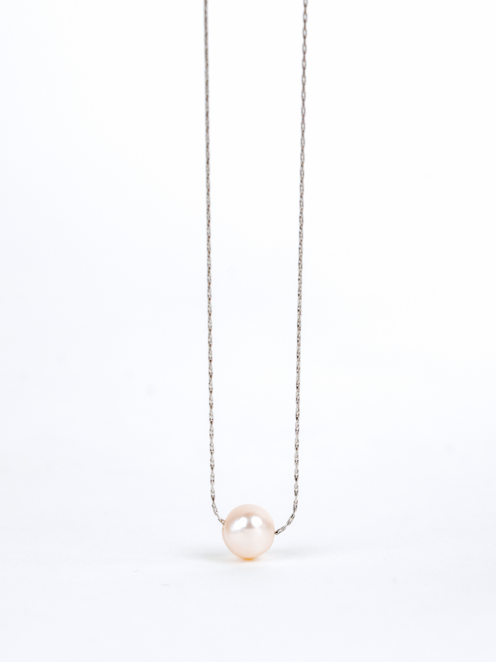 Close-up of natural irregular pearl on Devotion Necklace