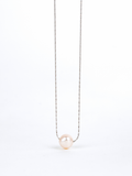 Close-up of natural irregular pearl on Devotion Necklace