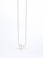 Close-up of natural irregular pearl on Devotion Necklace