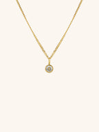 Diamond Curb Chain CZ Pendant Necklace gold tone titanium, round bezel-set CZ on fine curb chain, product flatlay
