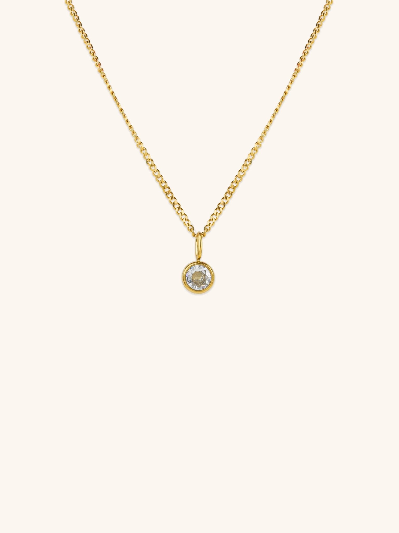 Diamond Curb Chain CZ Pendant Necklace gold tone titanium, round bezel-set CZ on fine curb chain, product flatlay
