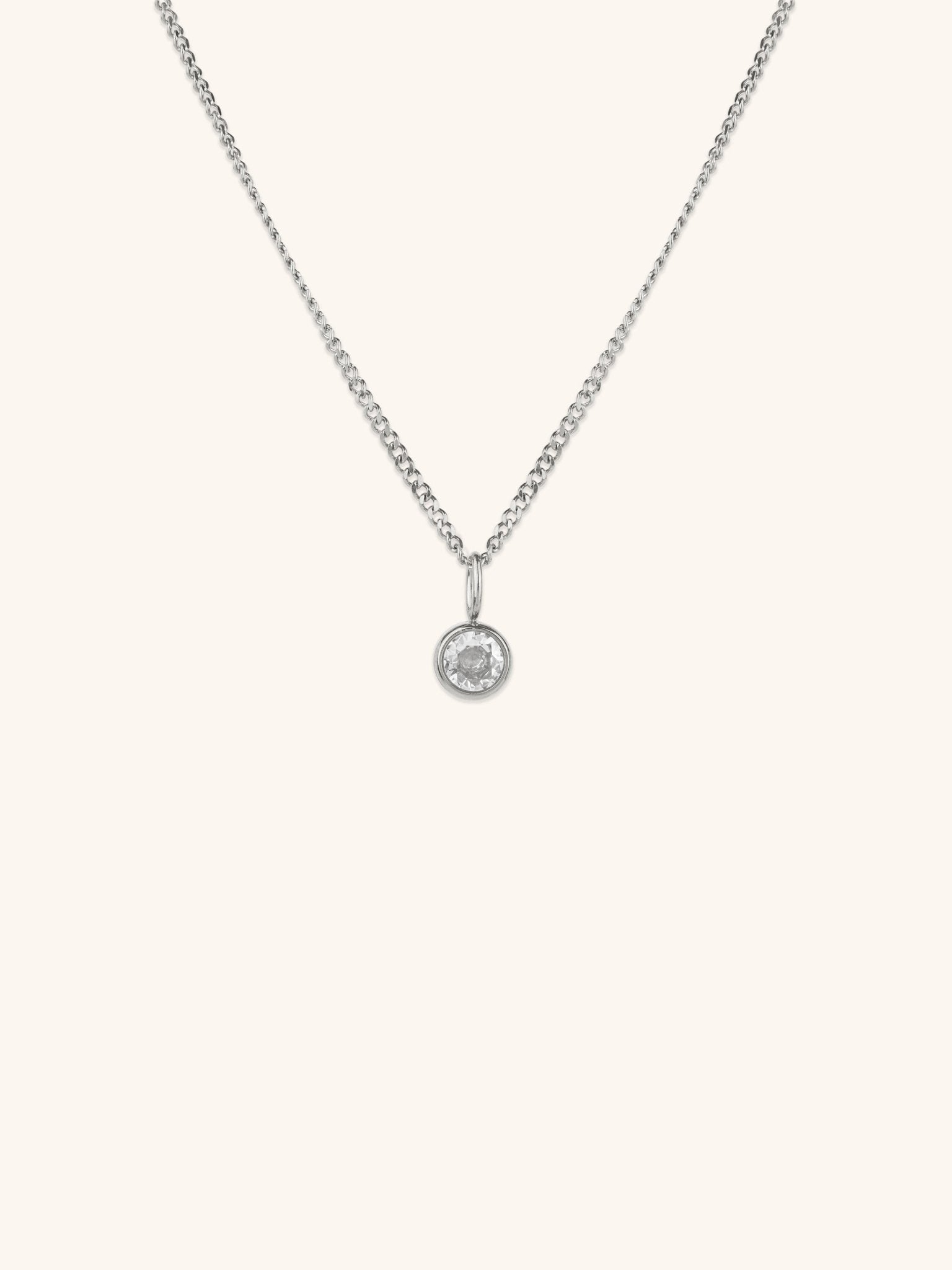 Diamond Curb Chain CZ Pendant Necklace silver tone titanium, round bezel-set CZ on fine curb chain, product flatlay