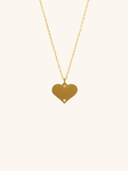 Diamond Heart Engravable Necklace gold tone worn on neck, large flat heart pendant with CZ accent, MNML Malaysia