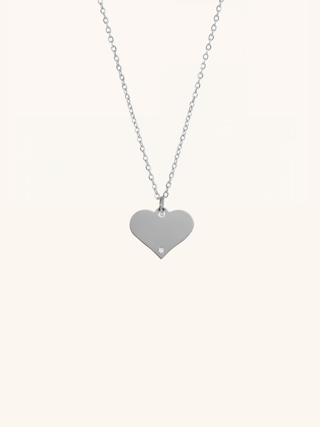 Diamond Heart Engravable Necklace silver tone titanium product flatlay, flat heart pendant on fine cable chain