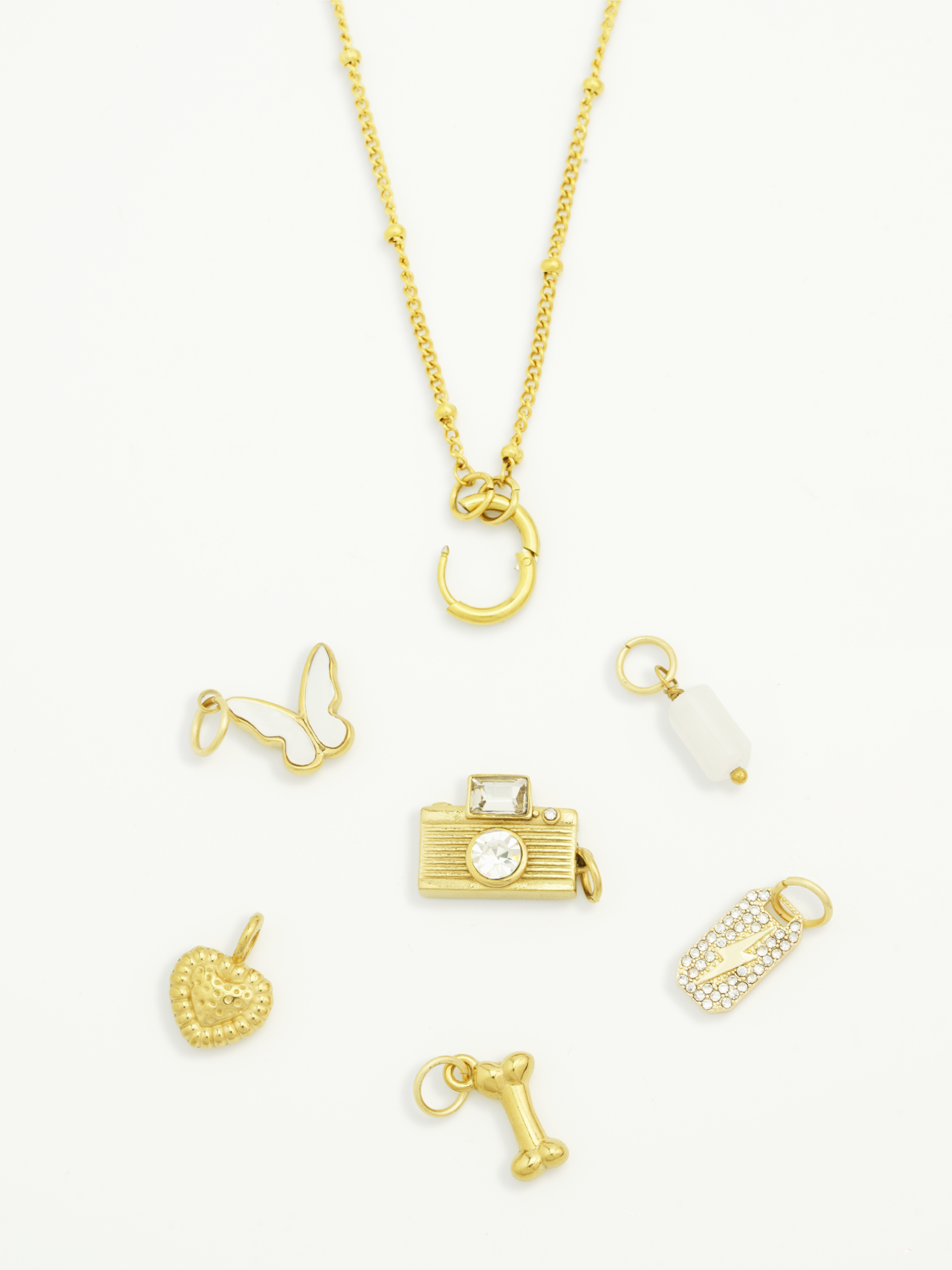 Minimalist bone charm 18K gold plated