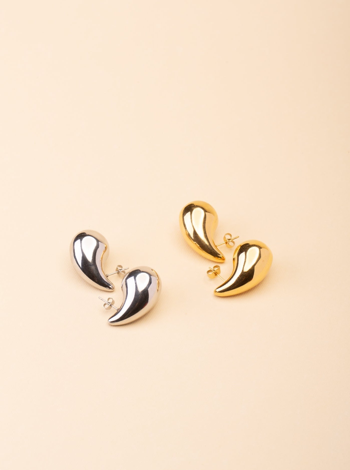 droplet earrings close up smooth curve detail