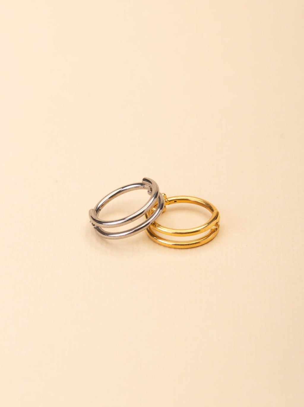 Duality Two-Lined Nose Ring gold and silver tone titanium, plain double-band nose ring, product flatlay