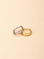 Duality Two-Lined Nose Ring gold and silver tone titanium, plain double-band nose ring, product flatlay