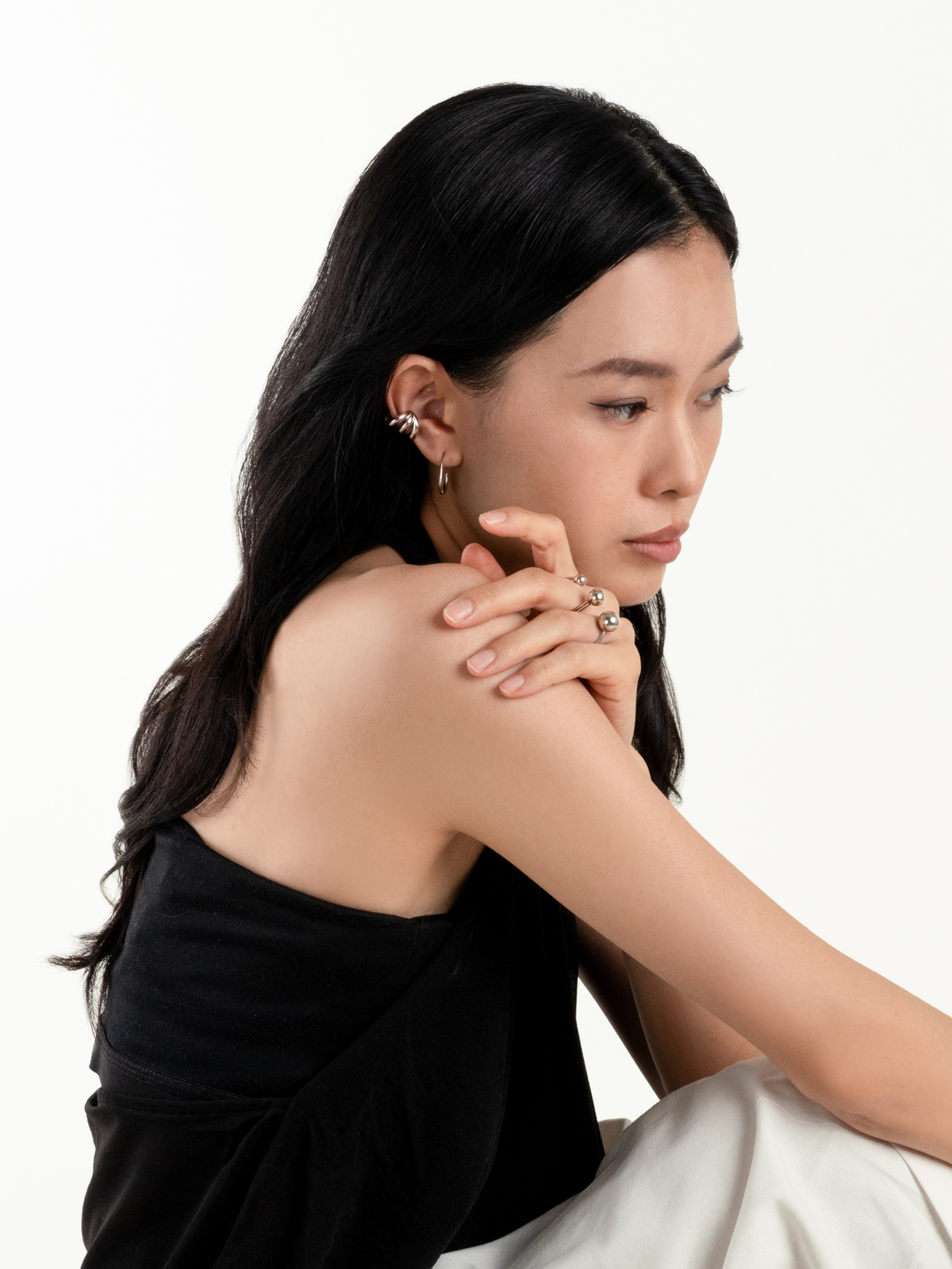 Close-up of triple-band sculptural design on Echo Ear Cuff