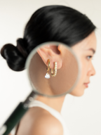 Elara Lumi Earrings worn on model's ear