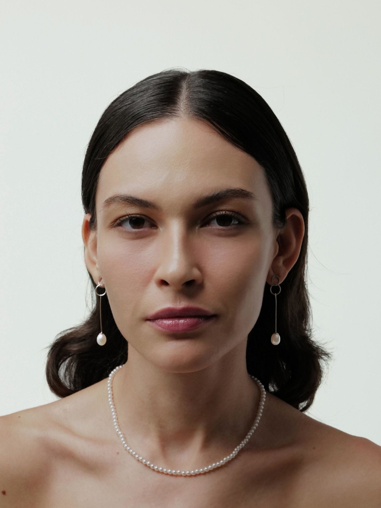 Elodie pearl drop earrings in white worn on ear, MNML Malaysia lifestyle shot