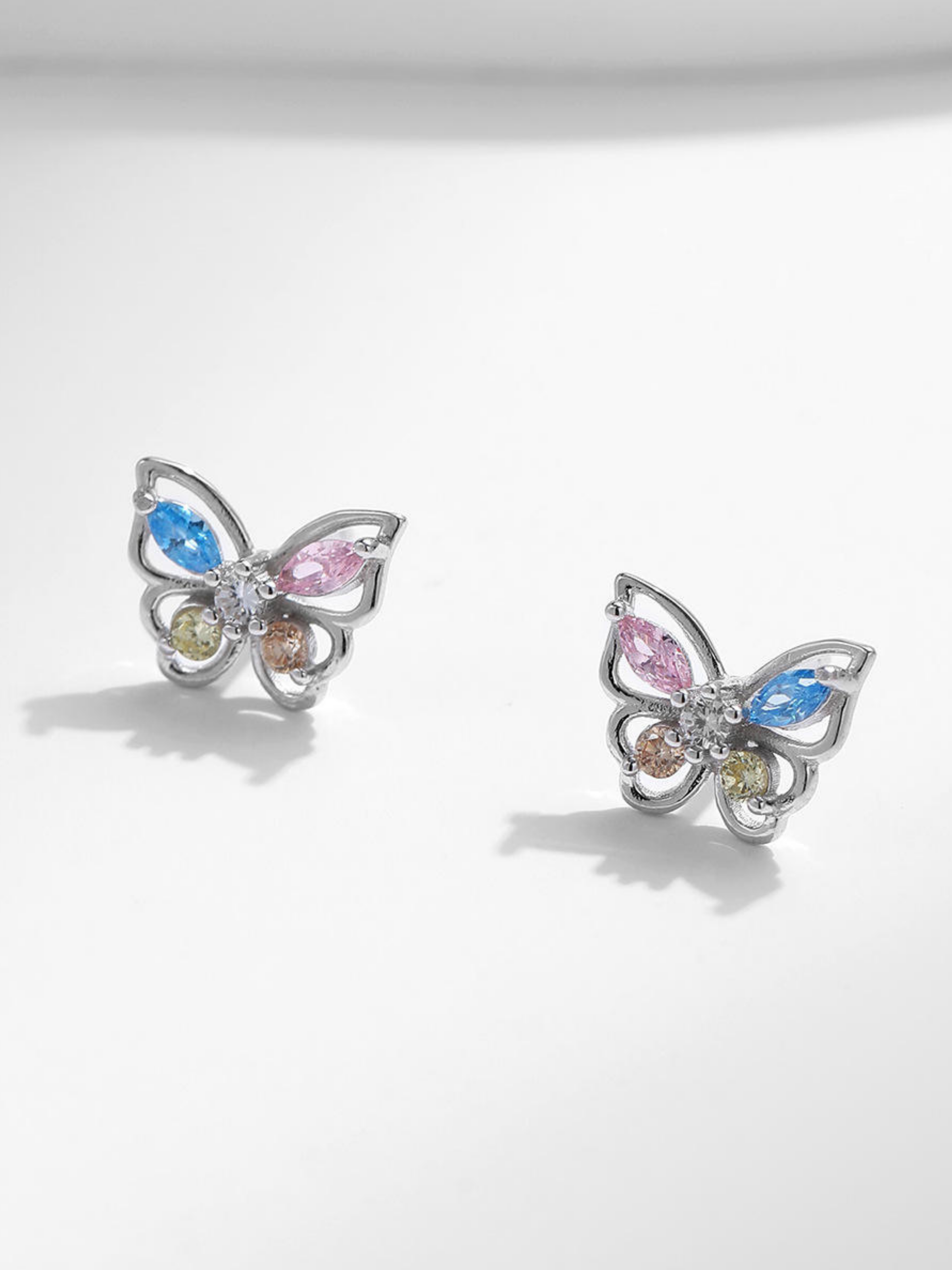Close-up of EMERSON Butterfly Diamond Ear Studs pair