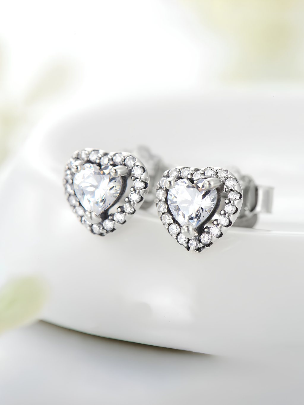 Side profile view of EMERY Heart Pavé Ear Stud