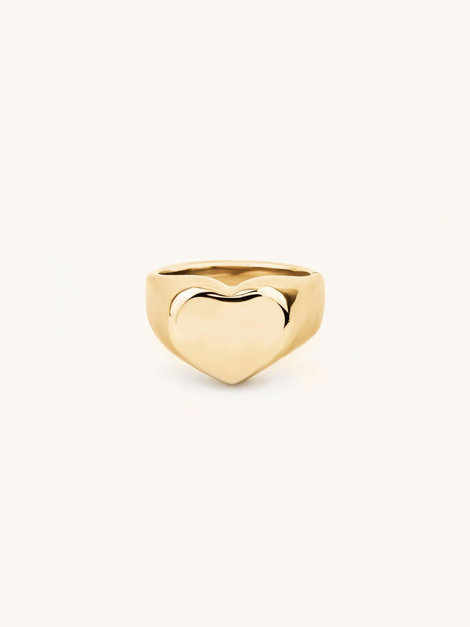 Eros Engravable Signet Ring gold tone titanium, heart-shaped signet face on tapered band, product flatlay