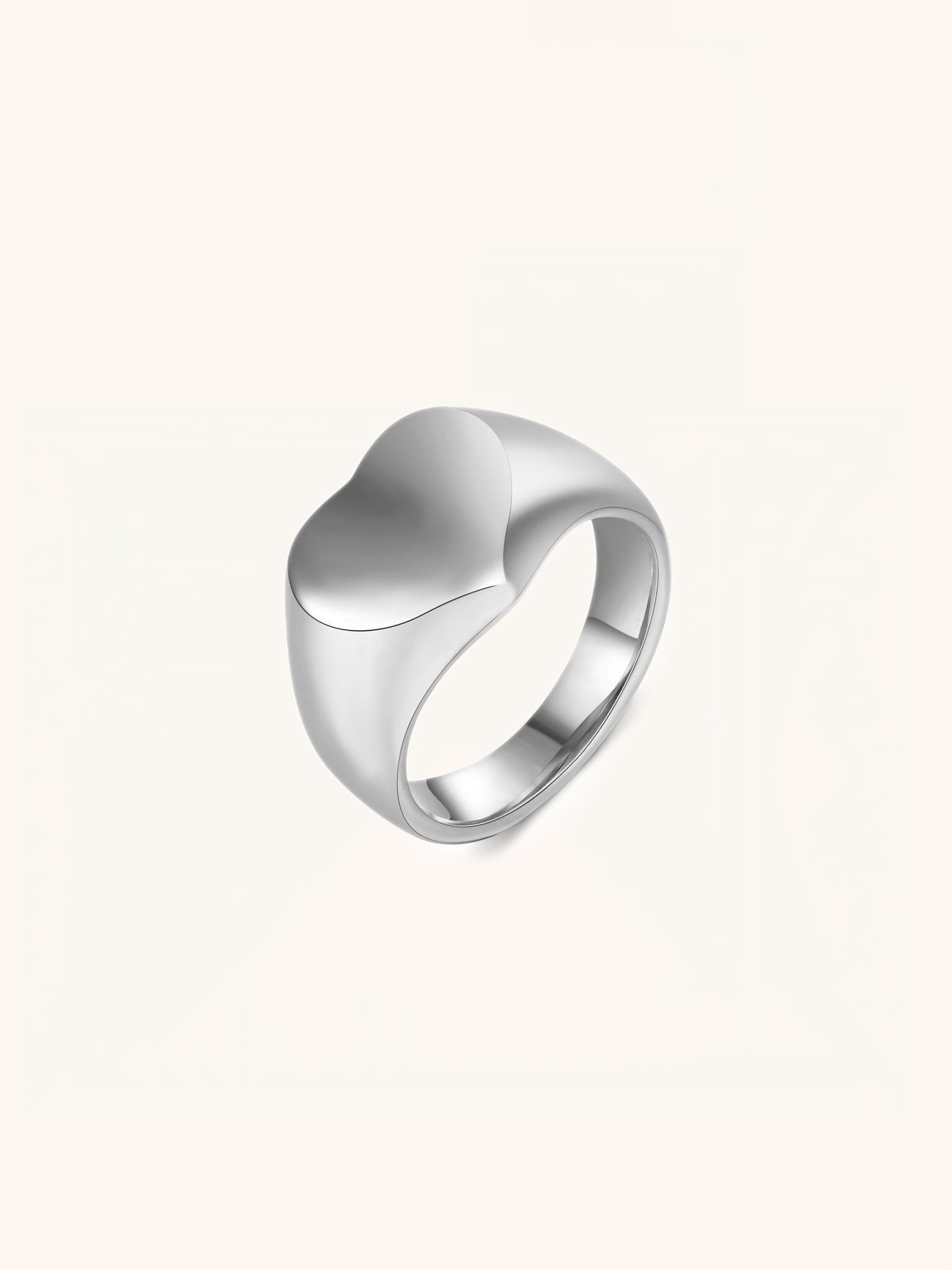 Eros Engravable Signet Ring silver tone titanium, heart-shaped signet face on tapered band, product flatlay