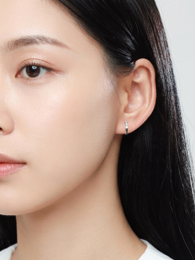 Model wearing EVA Diamond Huggie Earhoop