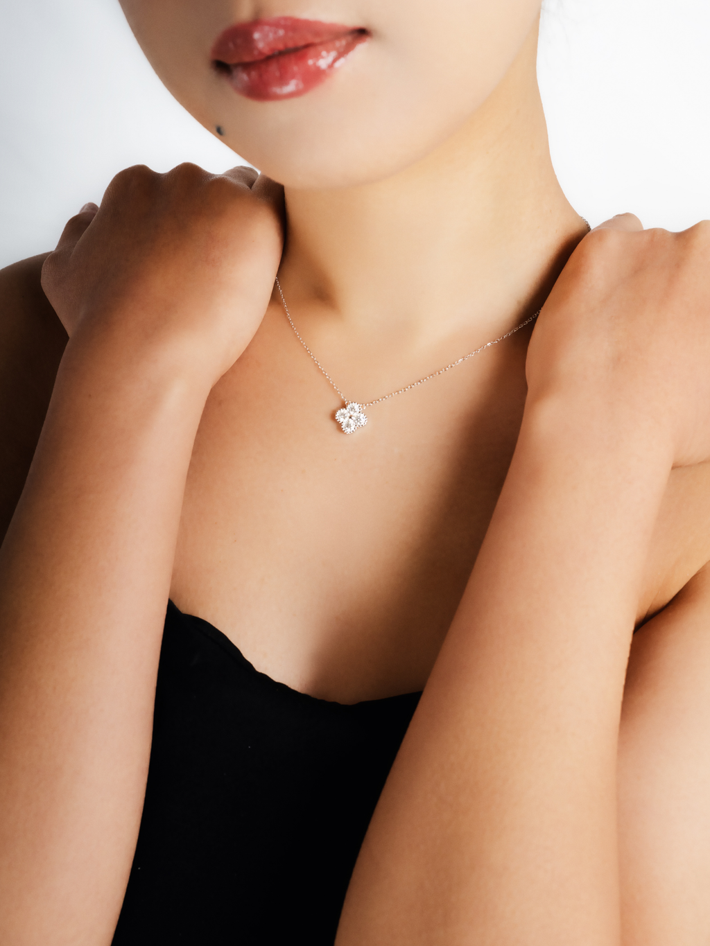 Everette clover moissanite necklace worn on neckline