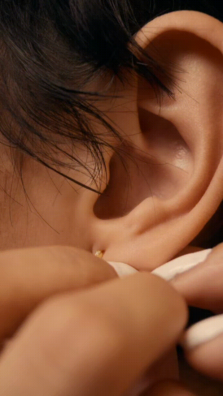 Close-up of FELIX Starlight pavé huggie earring