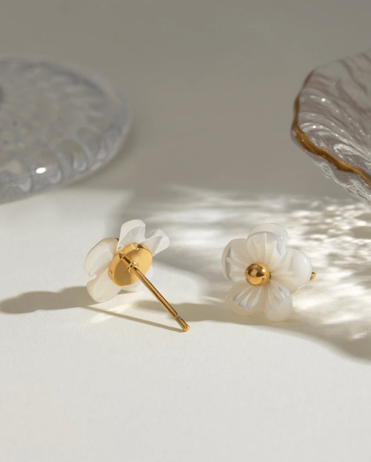 Close-up of Fleur Blanche Stud Earrings post and back closure