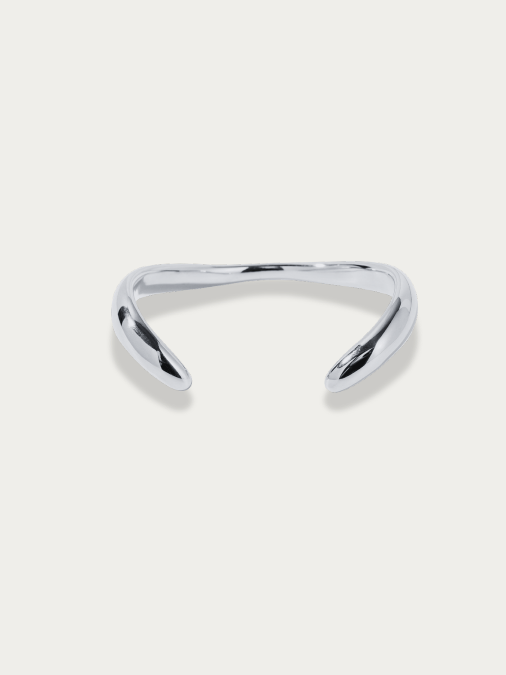 Flow Curved Bangle in silver titanium with fluid sculptural curves, studio hero shot