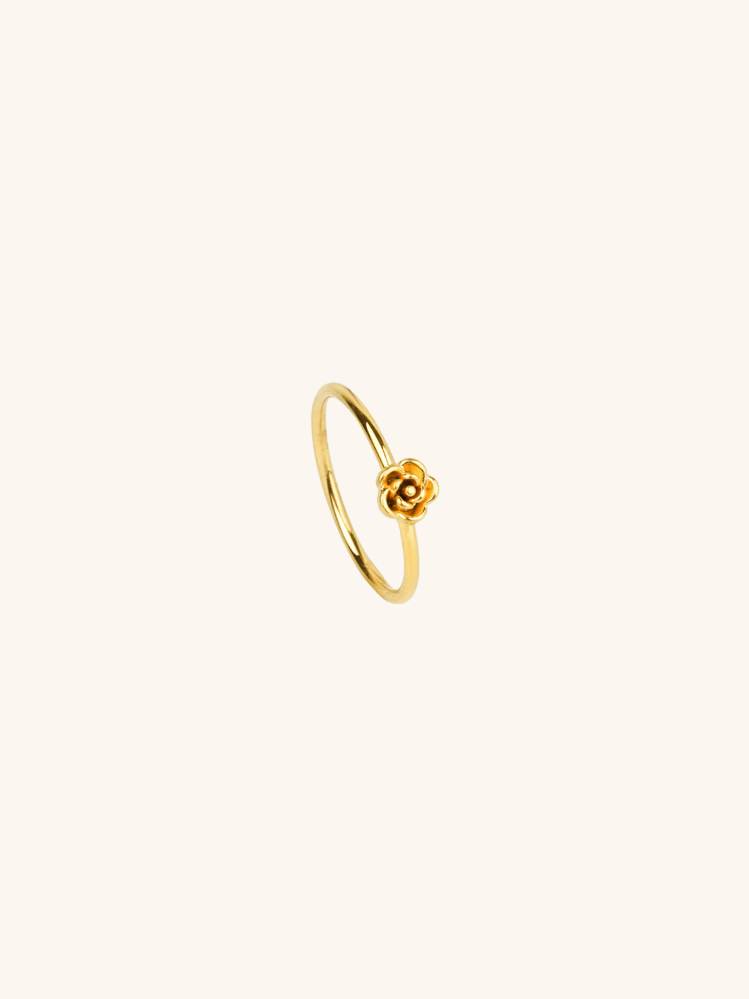 Flower Petals Ring gold tone stainless steel, sculpted 3D rose motif on slim band, product flatlay