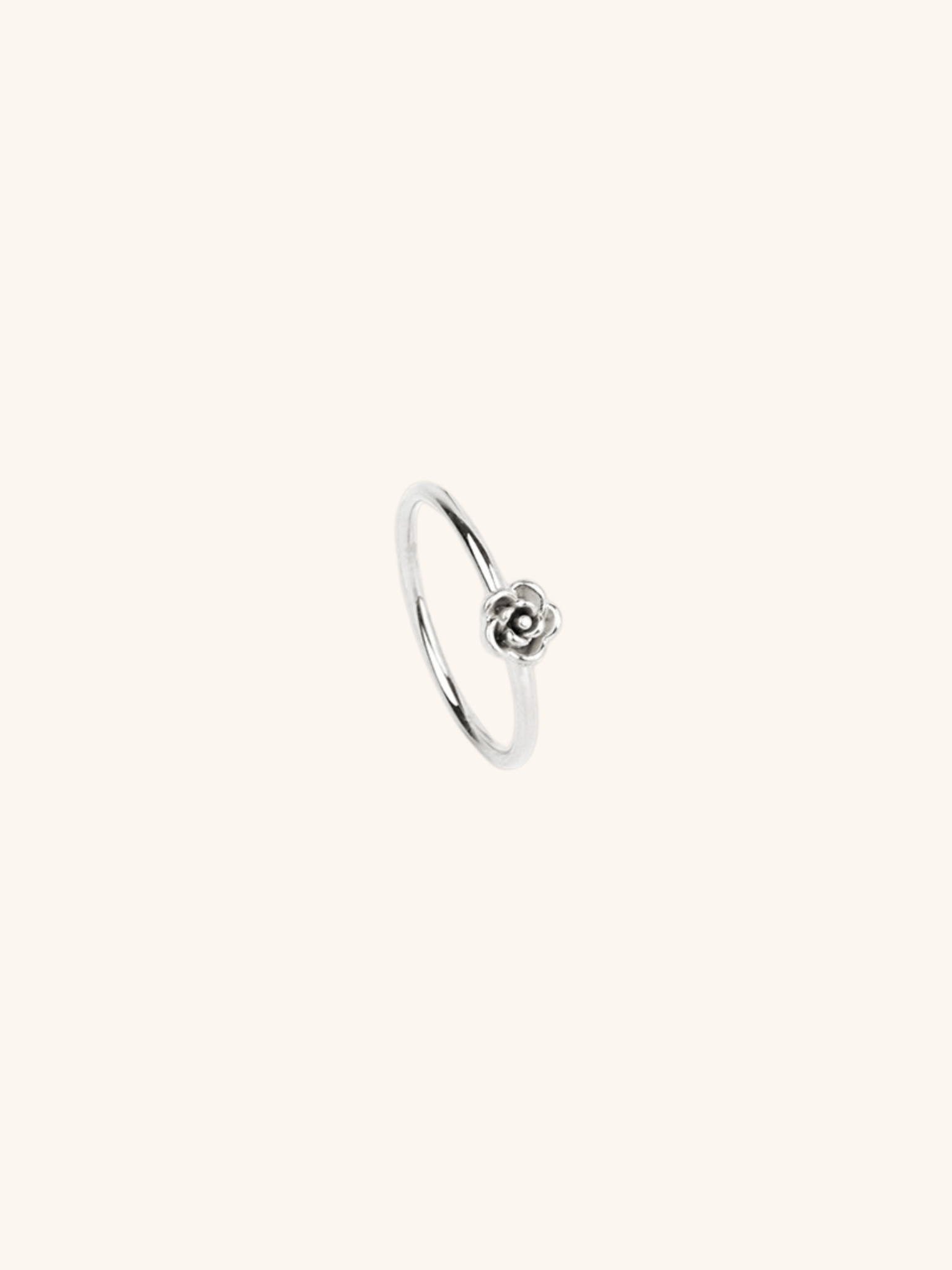 Flower Petals Ring silver tone stainless steel, sculpted 3D rose motif on slim band, product flatlay