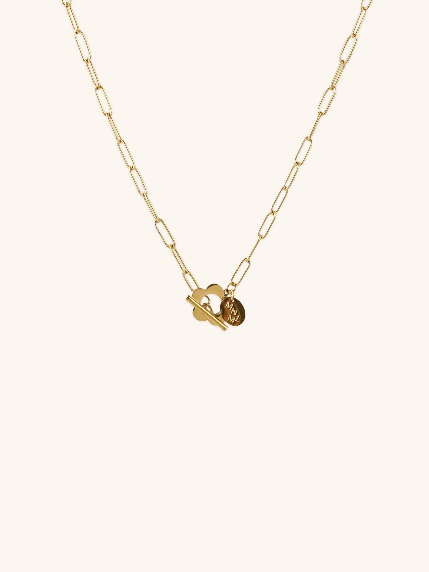 Flower Toggle Necklace gold tone stainless steel, bold paperclip chain with front toggle clasp and flower charm, product flatlay