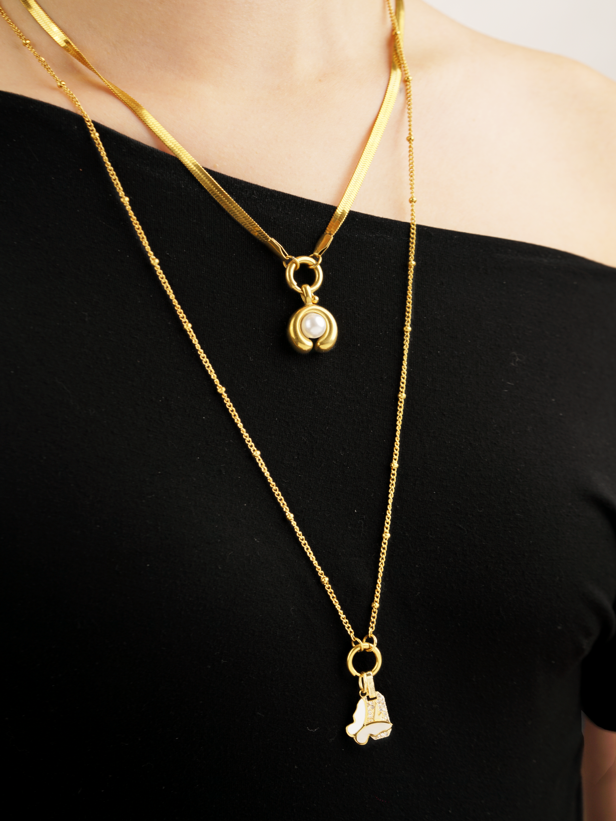 Mother of pearl butterfly charm layered styling