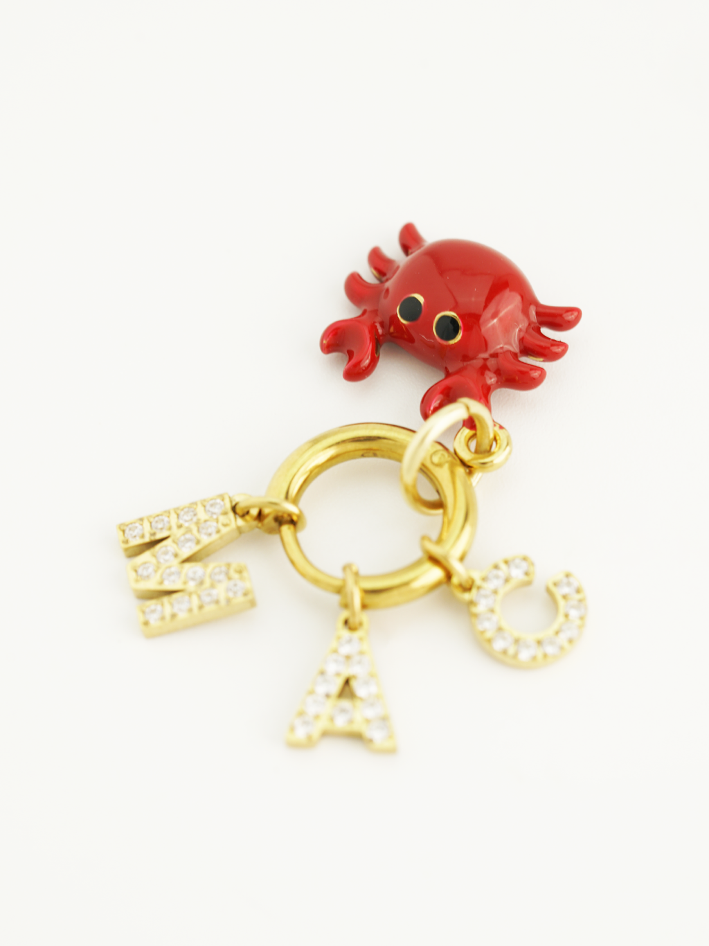 gold plated crab charm enamel detail close up
