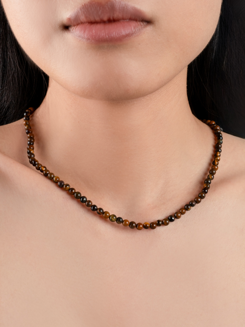 Grounded Tiger's Eye Necklace worn on neckline