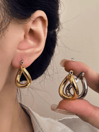 Gwenna Geo Drop Hoops worn on ear, gold finish
