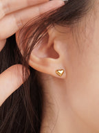 Heart Stud Earrings gold tone worn on ear, minimalist heart studs Malaysia lifestyle