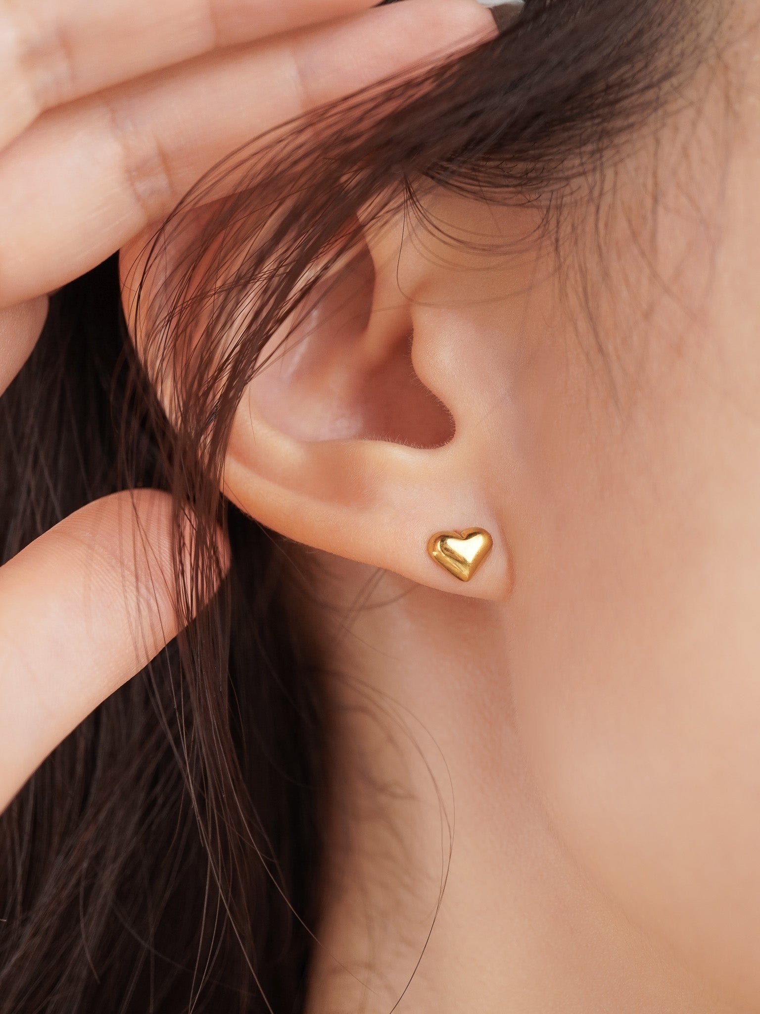 Heart Stud Earrings gold tone worn on ear, minimalist heart studs Malaysia lifestyle
