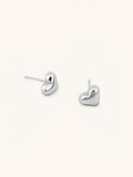 Heart Stud Earrings silver tone stainless steel, puffy 3D heart studs, product flatlay