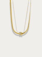 Herringbone Layered Rolling Stones Necklace gold tone titanium, herringbone and fine chain with CZ rolling rings pendant, product flatlay