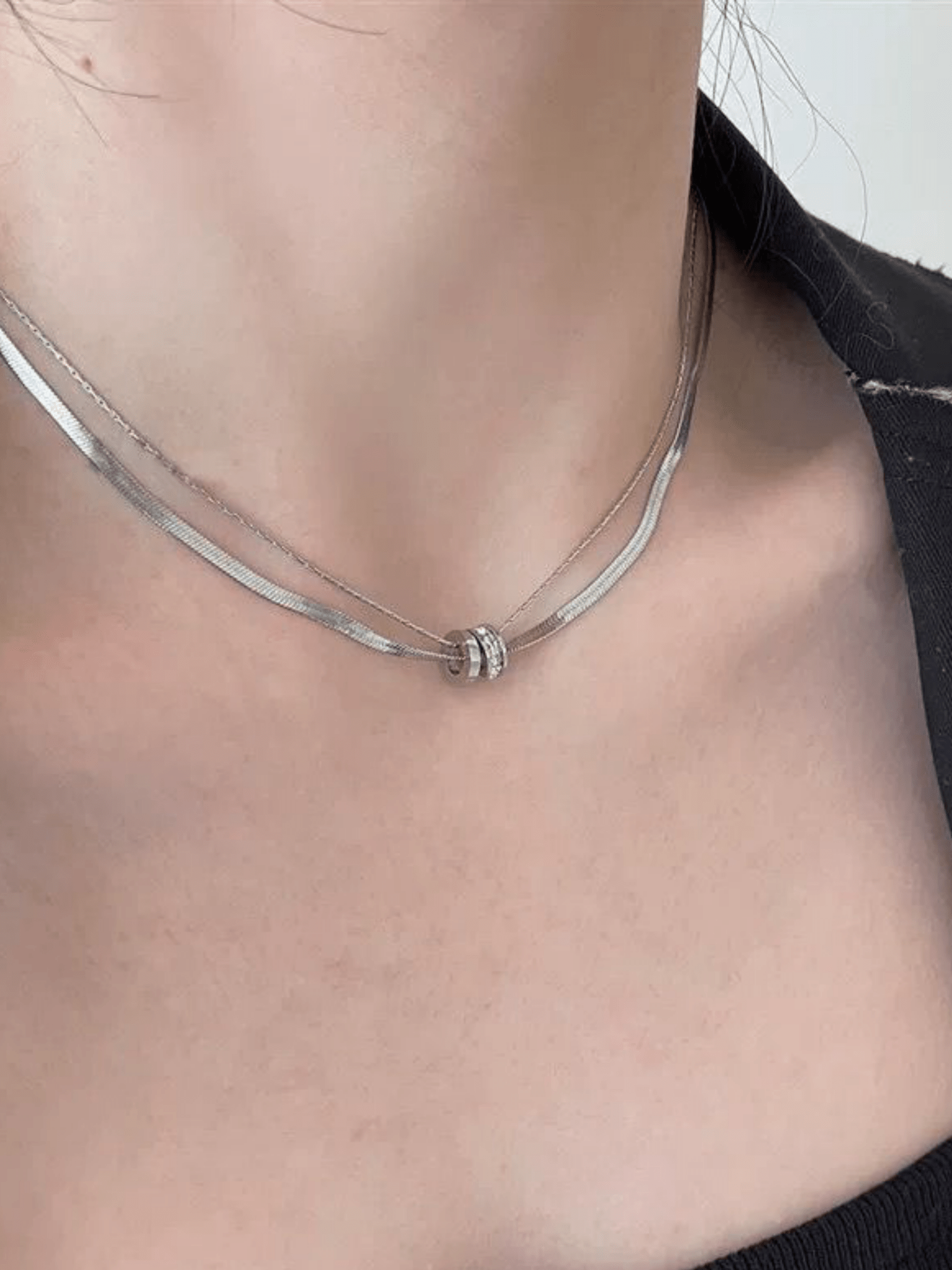 Herringbone Layered Rolling Stones Necklace silver tone titanium, herringbone and fine chain with CZ rolling rings pendant, product flatlay