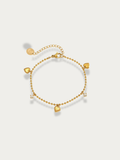 Jaye Heart Charm Bracelet gold tone stainless steel, bead chain with three heart and two CZ charms, product flatlay