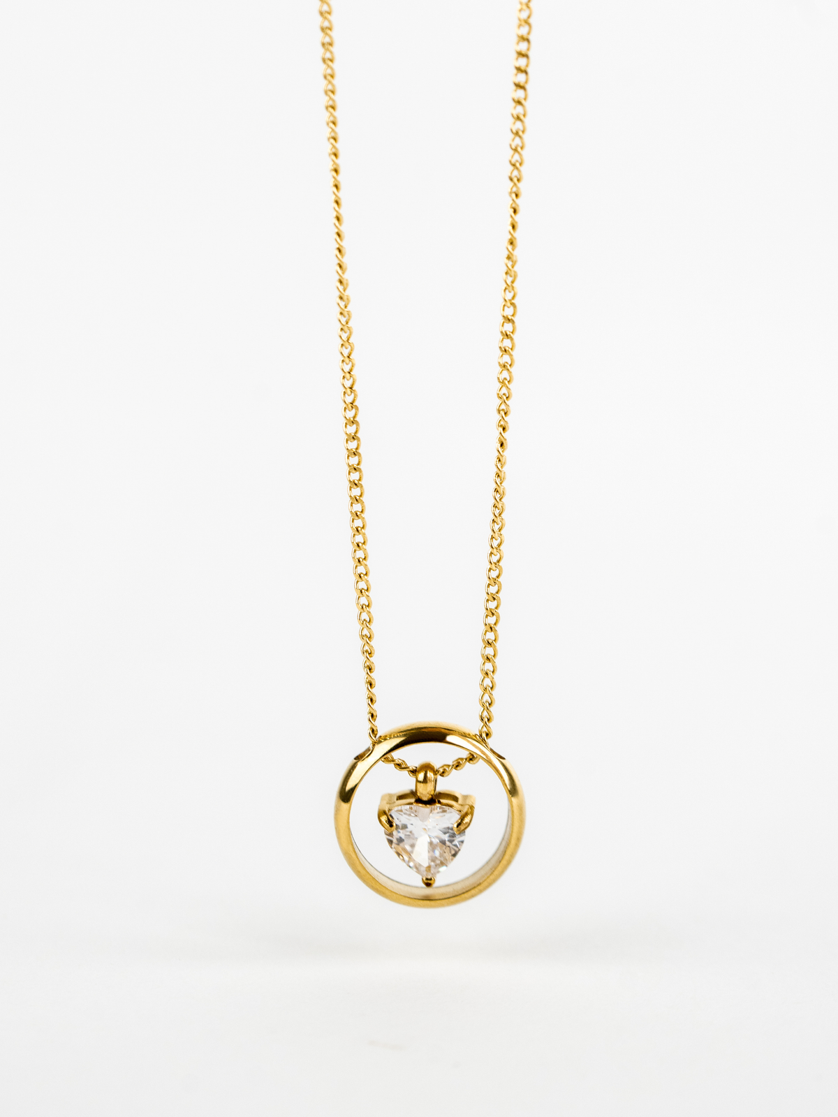 Close-up of heart-cut stone within open circle on Jeanette Necklace