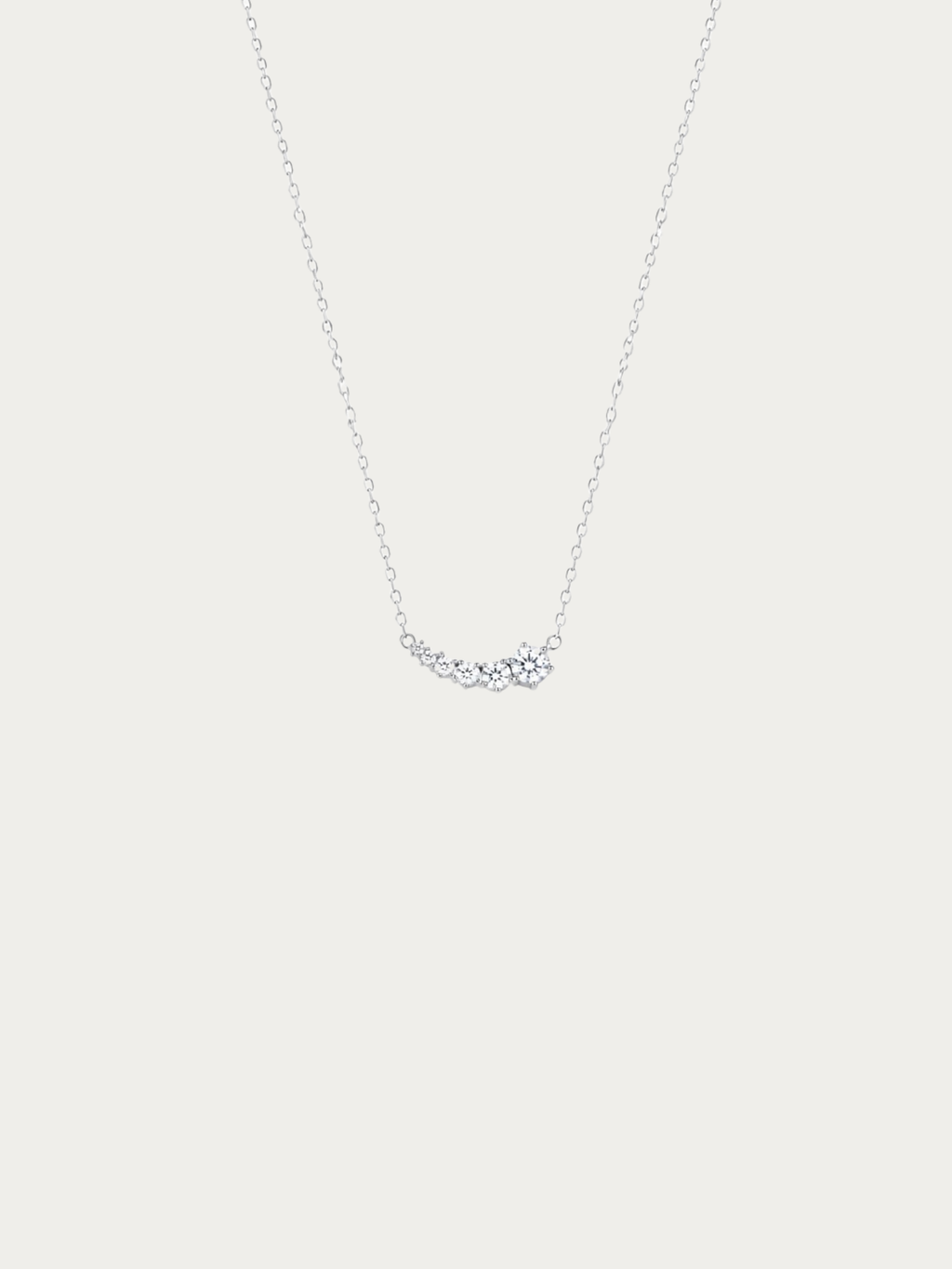 Jupiter Cascading Spark Necklace with curved cubic zirconia stones in silver