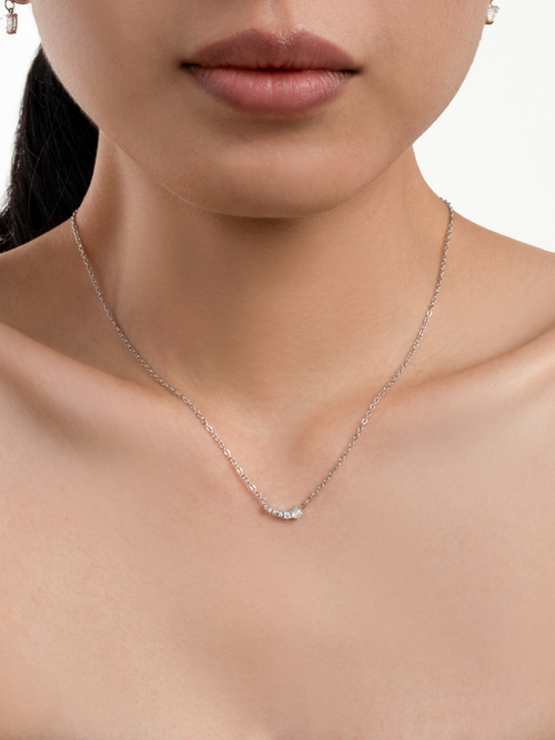 Jupiter Cascading Spark Necklace in silver colour worn on neckline