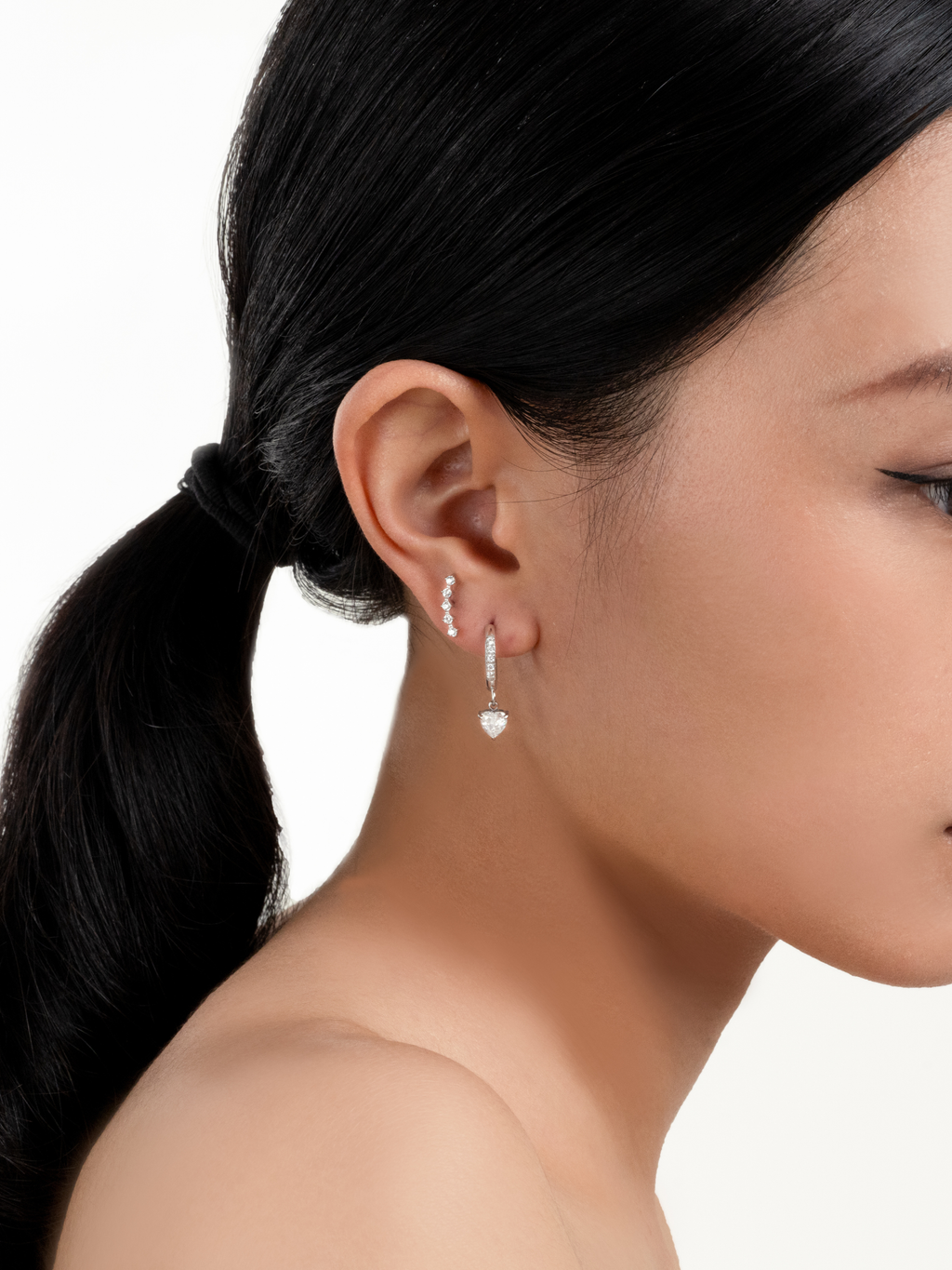 Jupiter Spark Stud Earrings worn on model's ear