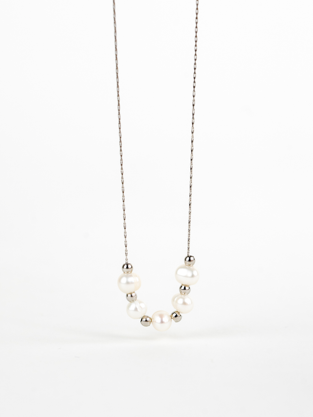 Close-up of naturally irregular freshwater pearls on Kindred Necklace