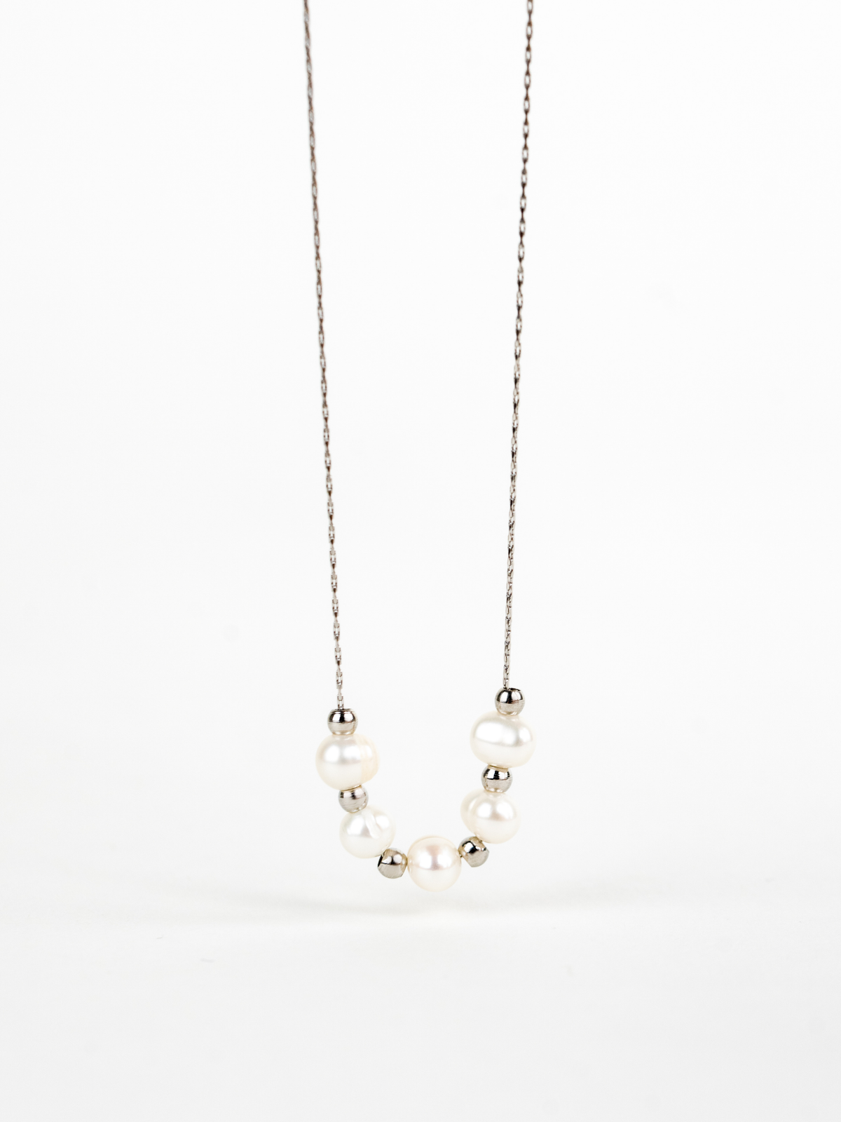 Close-up of naturally irregular freshwater pearls on Kindred Necklace