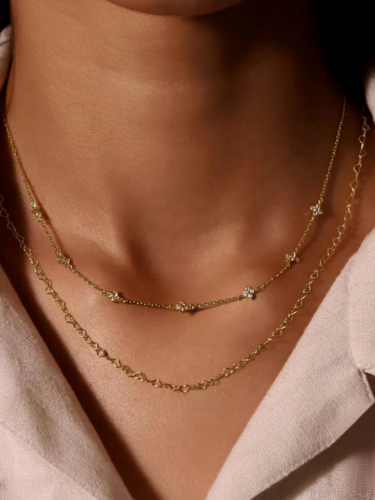 Model wearing LAUREL Floral Diamonds Necklace at the collarbone